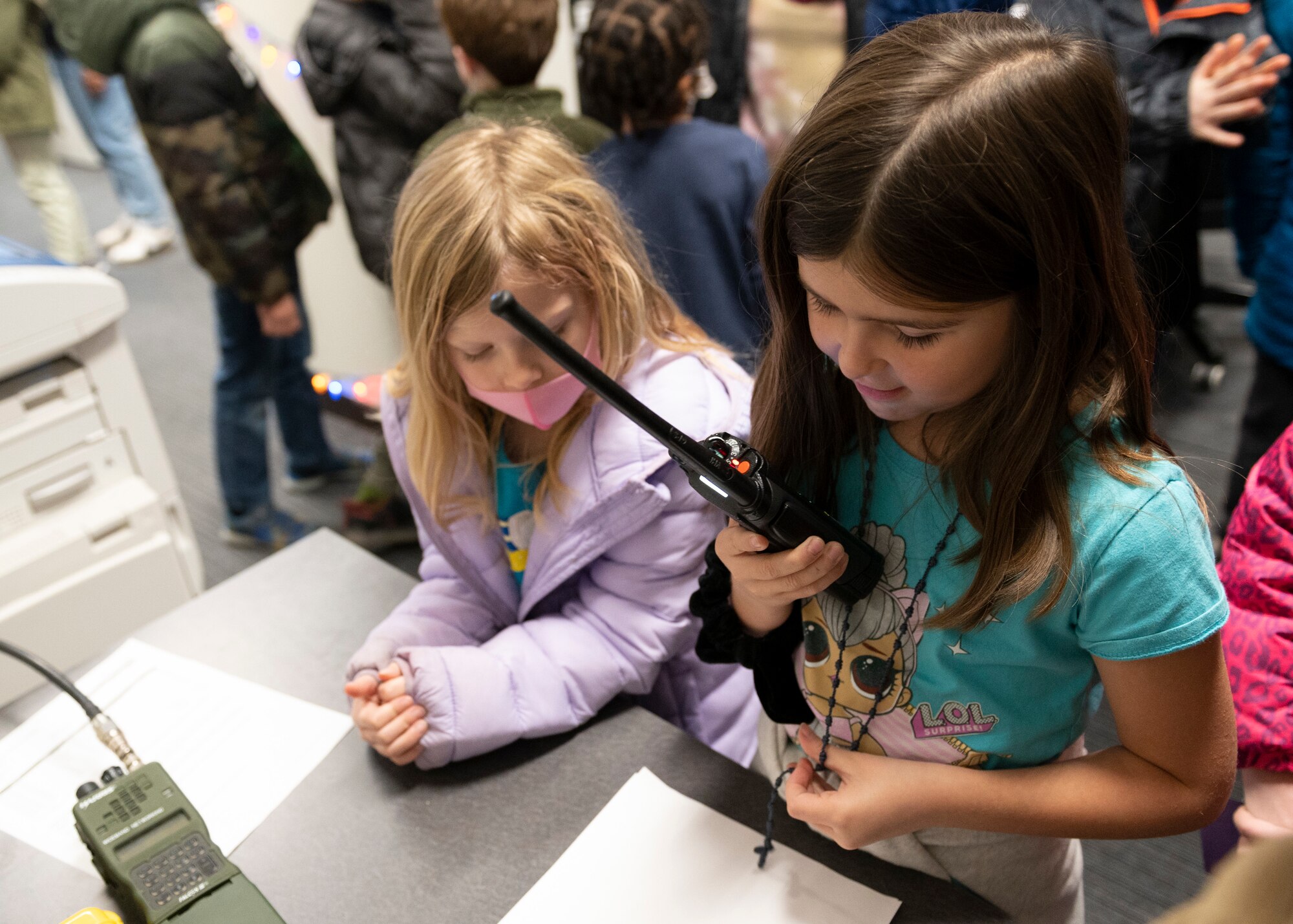 Kids speak into a radio