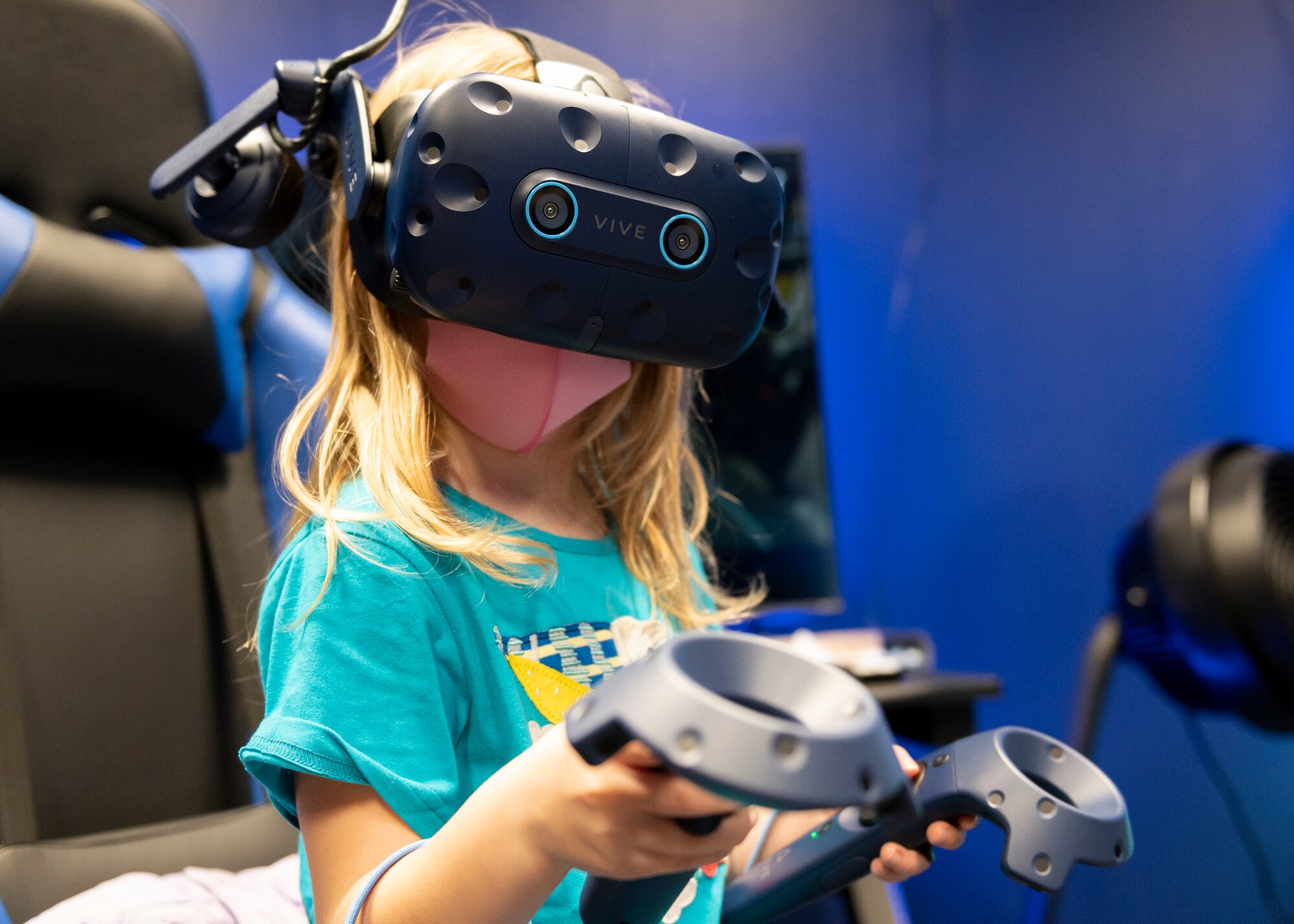 A kid wears a virtual reality headset