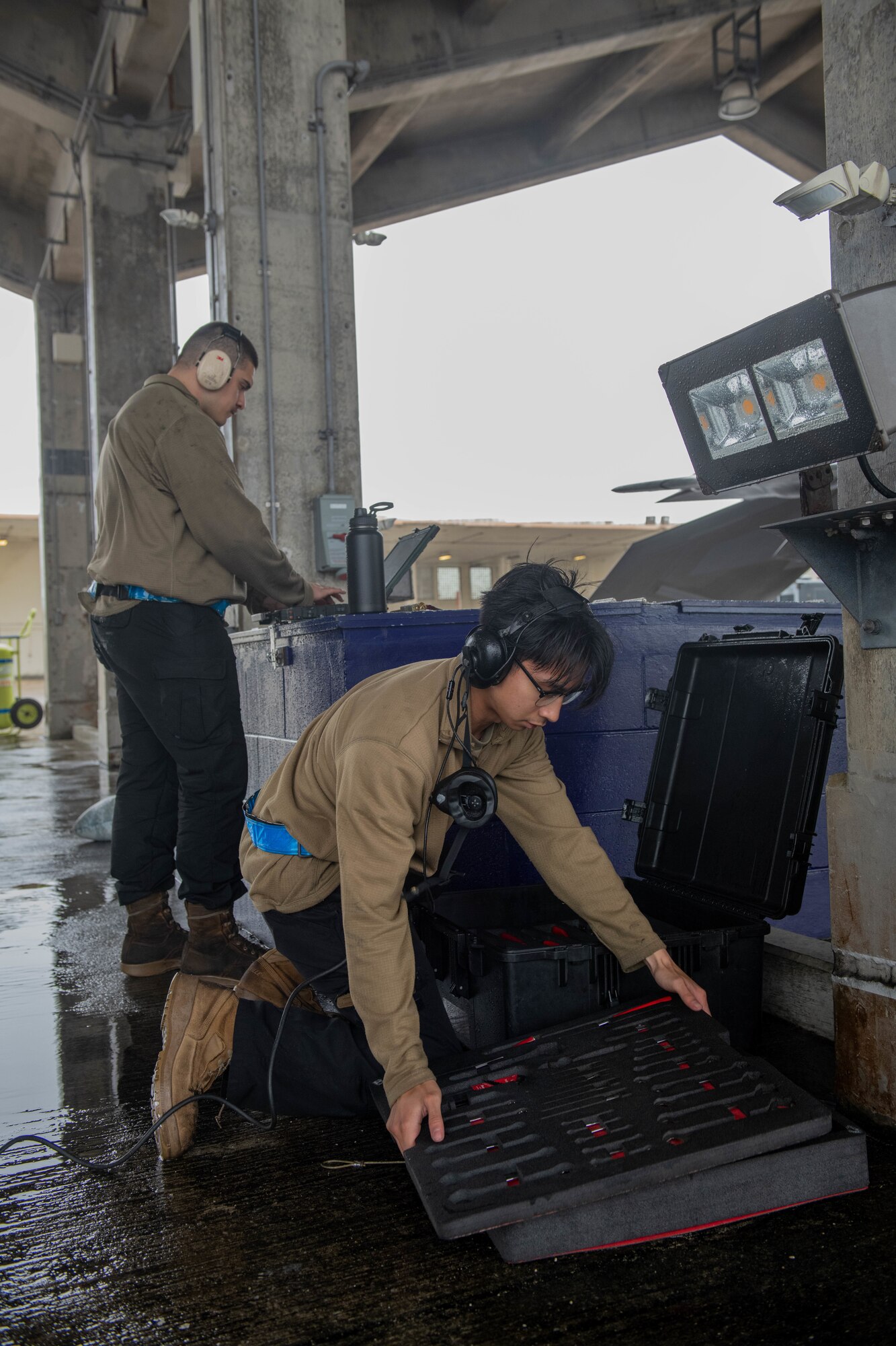 Airmen check their tools.