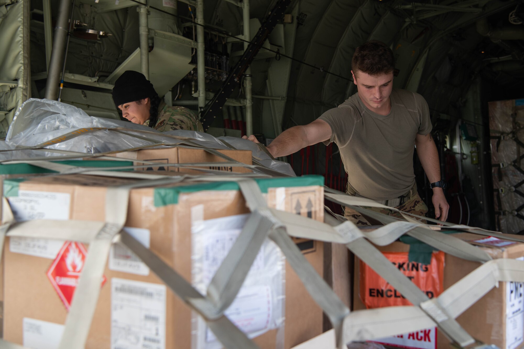 Airmen unload cargo.