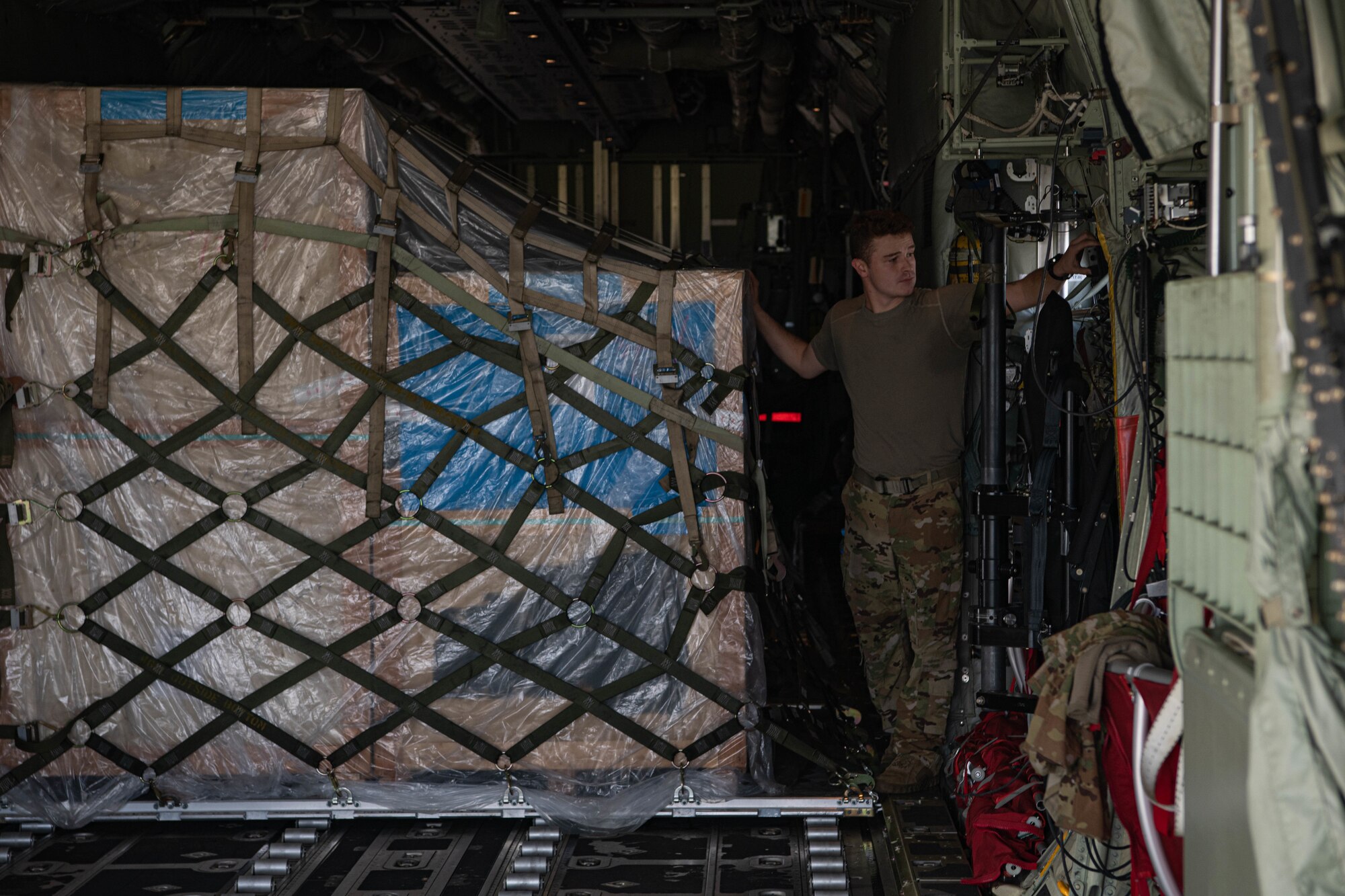 An Airman unloads cargo.