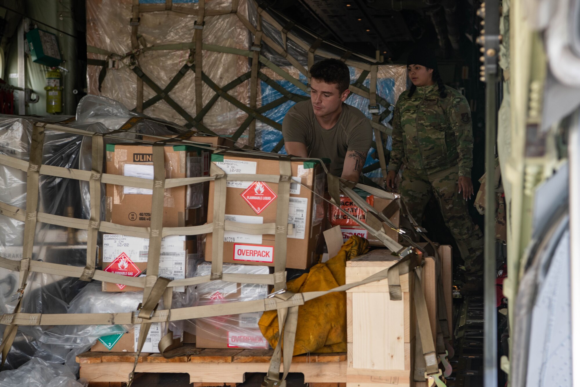An Airman unloads cargo.