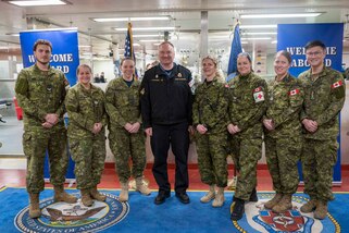 NORFOLK, Va. (Dec. 21 2022) Royal Canadian Navy Rear Adm. David Patchell, vice commander, U.S. 2nd Fleet, poses for a photo with Canadian Armed Forces personnel aboard the Military Sealift Command hospital ship USNS Comfort (T-AH 20) following its return to homeport at Naval Station Norfolk, Dec. 21. U.S. 2nd Fleet, reestablished in 2018 in response to the changing global security environment, develops and employs maritime forces ready to fight across multiple domains in the Atlantic and Arctic in order to ensure access, deter aggression and defend U.S., allied, and partner interests.  (U.S. Navy photo by Mass Communication Specialist 2nd Class Anderson W. Branch)