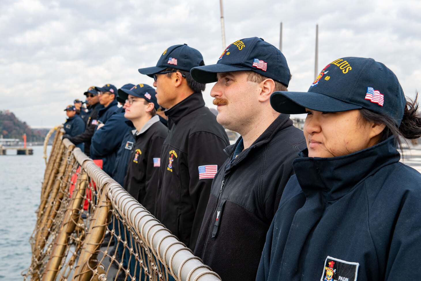 YOKOSUKA, JAPAN (Dec. 21, 2022) Sailors aboard Arleigh Burke-class guided-missile destroyer USS Milius (DDG 69) render honors as the ship returns to Commander, Fleet Activities Yokosuka, forward-deployed to Japan, Dec. 21. Milius is assigned to Commander, Task Force 71/Destroyer Squadron (DESRON) 15, the Navy’s largest forward-deployed DESRON and the U.S. 7th Fleet’s principal surface force. (U.S. Navy photo by Mass Communication Specialist 2nd Class Richard Cho)