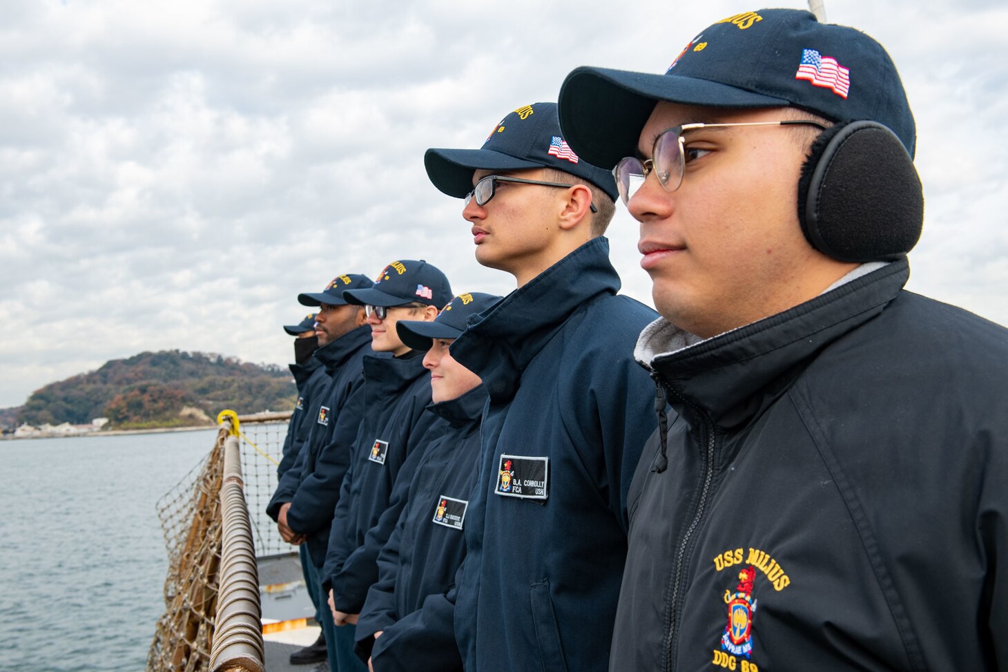 YOKOSUKA, JAPAN (Dec. 21, 2022) Sailors aboard Arleigh Burke-class guided-missile destroyer USS Milius (DDG 69) render honors as the ship returns to Commander, Fleet Activities Yokosuka, forward-deployed to Japan, Dec. 21. Milius is assigned to Commander, Task Force 71/Destroyer Squadron (DESRON) 15, the Navy’s largest forward-deployed DESRON and the U.S. 7th Fleet’s principal surface force. (U.S. Navy photo by Mass Communication Specialist 2nd Class Richard Cho)