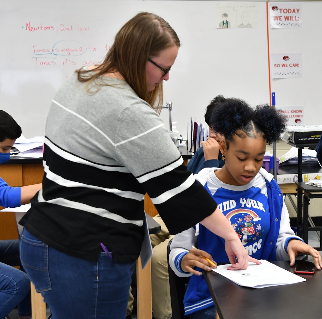 IMAGE: Naval Surface Warfare Center Dahlgren Division’s Megan Doblix assisted several eighth grade classrooms with programming robots at Walker-Grant Middle School Dec. 12. Students built, programmed and executed 11 different tasks for the robot to complete.
