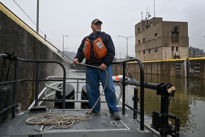 George Brkovich drives a boat and locks through a Lock and Dam.