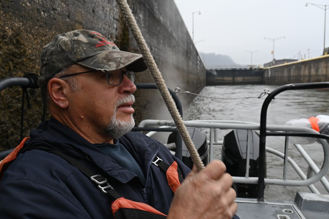 George Brkovich drives a boat and locks through a Lock and Dam.