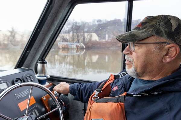 George Brkovich drives a boat and locks through a Lock and Dam.