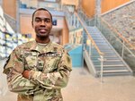 Staff Sgt. Dante Davis, an operations noncommissioned officer with 54th Troop Command, New Hampshire Army National Guard, poses for a photo on Dec. 21, 2022, in the atrium of the Edward Cross Training Complex in Pembroke, New Hampshire.