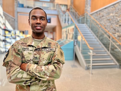 Staff Sgt. Dante Davis, an operations noncommissioned officer with 54th Troop Command, New Hampshire Army National Guard, poses for a photo on Dec. 21, 2022, in the atrium of the Edward Cross Training Complex in Pembroke, New Hampshire.