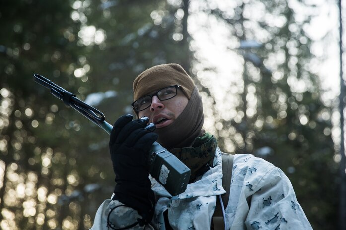 A U.S. Marine with Marine Rotational Force-Europe 19.1, Marine Forces Europe and Africa, operates a handheld radio during Exercise Northern Wind 19 in northern Sweden, March 22, 2019. This exercise focuses on enhancing Marines’ proficiency with cold-weather equipment while enhancing basic winter-warfare skills in cold-weather environments.