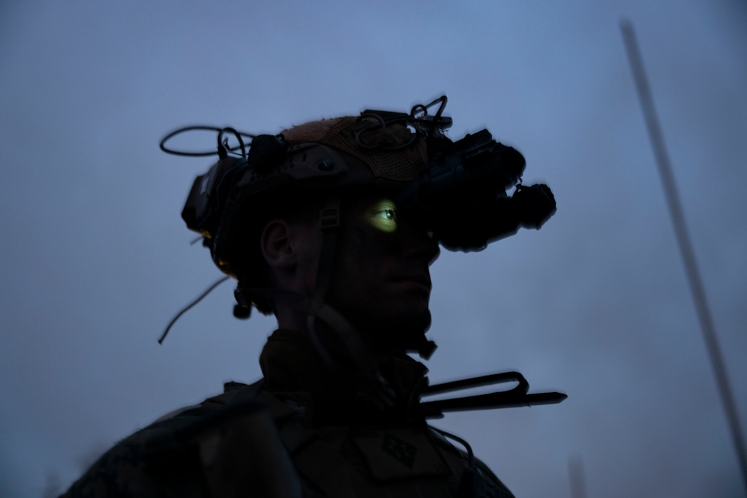 A U.S. Marine with the Battalion Landing Team 1/6, 26th Marine Expeditionary Unit waits to enter an aircraft prior to conducting a simulated raid during Marine Expeditionary Unit Exercise I. Marine Corps Auxiliary Landing Field Bogue, North Carolina, Dec. 20, 2022. The raid was the culminating MAGTF mission for the exercise. Through continued training and preparation, the 26th MEU will continue to be the nation’s premier expeditionary force-in readiness and remains ready and able to respond at a moment’s notice.