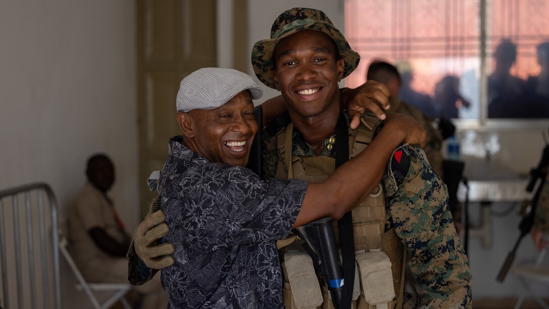 U.S. Marine Corps Pfc. Johvany Moize, a Brooklyn, New York native and machine gunner with 1st Battalion, 8th Marine Regiment, 2d Marine Division, poses for a photo with his father during Continuing Promise 2022 in Jeremie, Haiti, Dec. 14, 2022.

“[Being naturalized] was a good feeling,” said Moize. “It didn’t feel real to me that I was an actual citizen. To come from Haiti and go to the United States and you become a citizen, that’s a big thing. That’s something you should be proud of for your whole life.” 

The Continuing Promise mission includes providing direct medical care and expeditionary veterinary care, conducting training and subject matter expert exchanges on various medical and humanitarian civic assistance topics, and leading seminars on Women, Peace, and Security. 

(U.S. Marine Corps photo by Lance Cpl. Ryan Ramsammy)