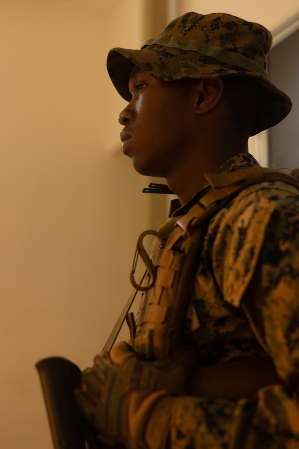 U.S. Marine Corps Pfc. Johvany Moize, a Brooklyn, New York native and machine gunner with 1st Battalion, 8th Marine Regiment, 2d Marine Division, waits to screen patients during Continuing Promise 2022 in Jeremie, Haiti, Dec. 16, 2022. The Continuing Promise mission includes providing direct medical care and expeditionary veterinary care, conducting training and subject matter expert exchanges on various medical and humanitarian civic assistance topics, and leading seminars on Women, Peace, and Security. (U.S. Marine Corps photo by Lance Cpl. Ryan Ramsammy)