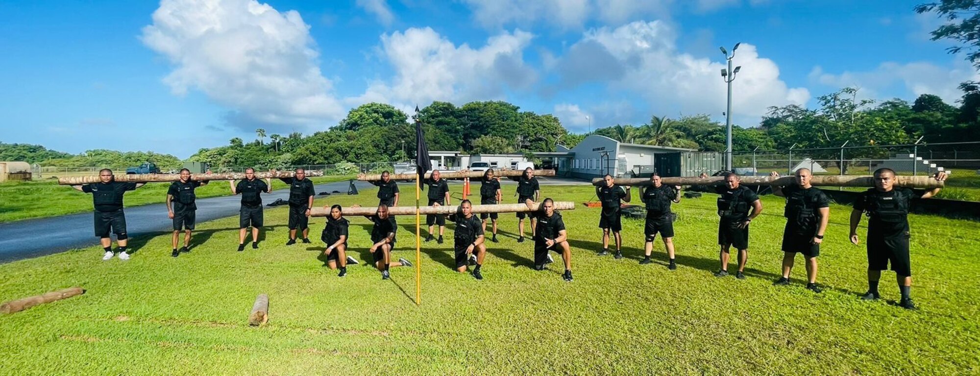 Members from the 36th Security Forces Squadron and local law enforcement personnel pose for a photo during a Special Enforcement Tactics course on Guam, Dec. 16, 2022.