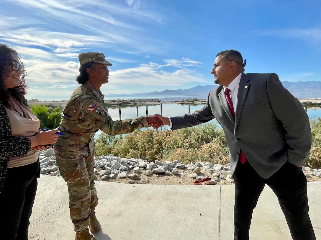 Brig. Gen. Antoinette Gant, commander of the Corps’ South Pacific Division, left, shakes hands with Guillermo Hernandez, field representative for Eduardo Garcia, 56th District, Imperial County, California, right, following a Dec. 16 signing ceremony for the Imperial Streams Salton Sea Feasibility Cost-Share Agreement between the U.S. Army Corps of Engineers Los Angeles District, California Department of Water Resources and the Salton Sea Authority at the North Shore Yacht Club in Mecca, California.