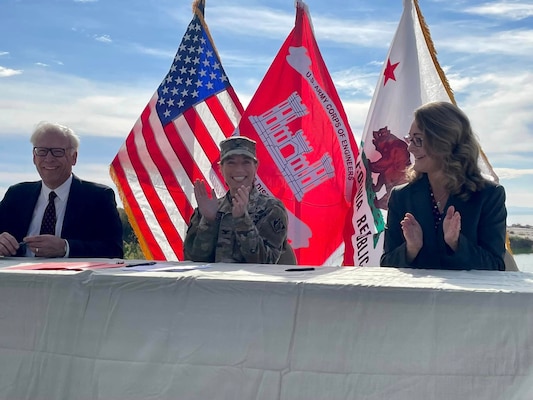 From left to right, G. Patrick O’Dowd, executive director, Salton Sea Authority; Col. Julie Balten, commander of the U.S. Army Corps of Engineers Los Angeles District; and Cindy Messer, chief deputy director, California Department of Water Resources, celebrate after signing the Imperial Streams Salton Sea Feasibility Cost-Share Agreement during a Dec. 16 signing ceremony near the shores of the Salton Sea in Mecca, California.