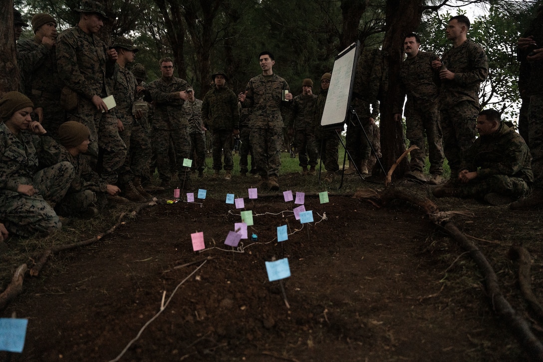 Marines with Combat Logistics Battalion 4, Combat Logistics Regiment 3, 3rd Marine Logistics Group, conduct a convoy brief during exercise Winter Workhorse 23 at Ie Shima Island, Okinawa, Japan, Dec. 6, 2022. Winter Workhorse is an annual exercise for CLR-3 to train to carry out mission-essential tasks in forward-deployed, austere environments. (U.S. Marine Corps photo by Cpl. Madison Santamaria)