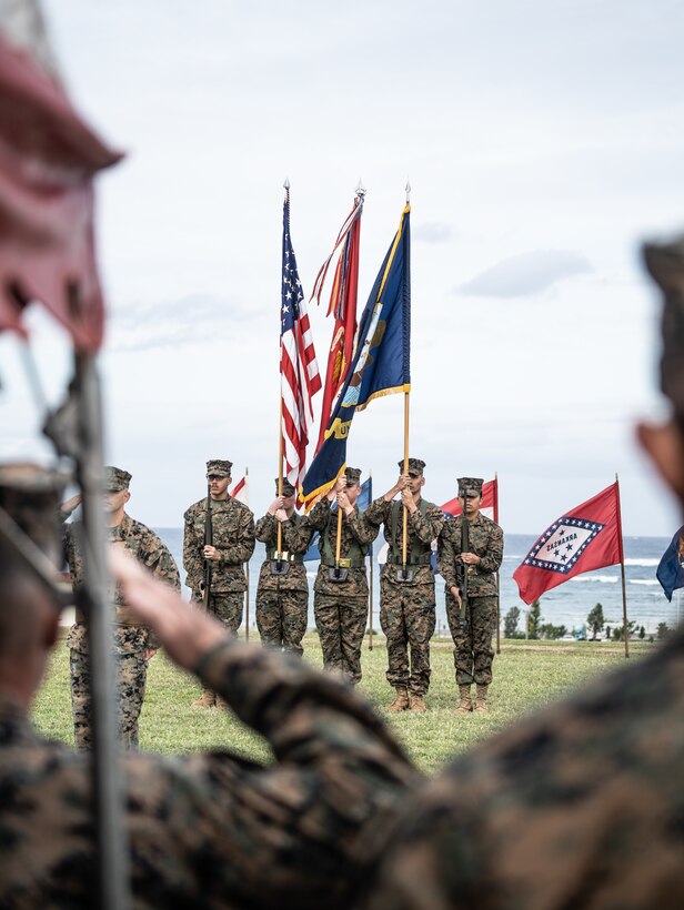 U.S. Marines  with the Combat Logistics Regiment 37 Color Guard, present the colors during a relief ceremony on Camp Kinser, Okinawa, Japan, Dec. 15, 2022. U.S. Navy Command Master Chief Ziervogel relinquished his post after 2 years of service with 3rd MLG. 3rd MLG, based out of Okinawa, Japan, is a forward-deployed combat unit that serves as III Marine Expeditionary Force’s comprehensive logistics and combat service support backbone for operations throughout the Indo-Pacific area of responsibility. (U.S. Marine Corps photo by Cpl. Moises Rodriguez)