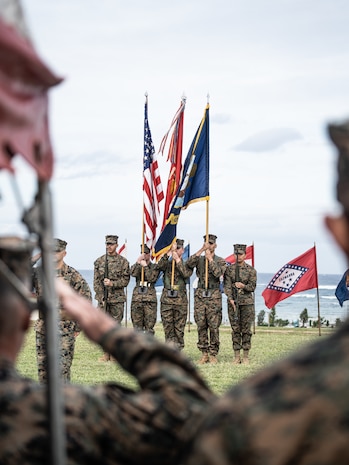 U.S. Marines  with the Combat Logistics Regiment 37 Color Guard, present the colors during a relief ceremony on Camp Kinser, Okinawa, Japan, Dec. 15, 2022. U.S. Navy Command Master Chief Ziervogel relinquished his post after 2 years of service with 3rd MLG. 3rd MLG, based out of Okinawa, Japan, is a forward-deployed combat unit that serves as III Marine Expeditionary Force’s comprehensive logistics and combat service support backbone for operations throughout the Indo-Pacific area of responsibility. (U.S. Marine Corps photo by Cpl. Moises Rodriguez)