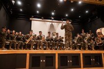 The U.S. Marine Corps III Marine Expeditionary Force band plays music prior to a change of command ceremony at Camp Kinser, Okinawa, Japan, Dec. 16, 2022. During the ceremony, Col. Douglas R. Burke, outgoing commanding officer, relinquished command of Combat Logistics Regiment 37 to Col. Andre M. Ingram, oncoming commanding officer. 3rd Marine Logistics Group, based out of Okinawa, Japan, is a forward deployed combat unit that serves as III Marine Expeditionary Force’s comprehensive logistics and combat service support backbone for operations throughout the Indo-Pacific area of responsibility. (U.S. Marine Corps photo by Lance Cpl. Sydni Jessee)