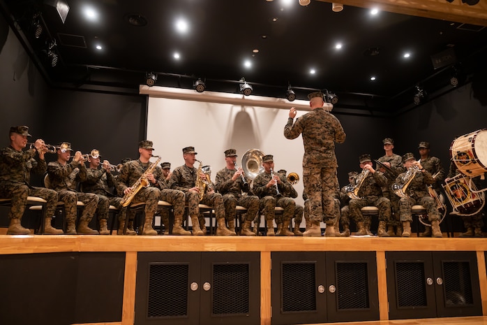 The U.S. Marine Corps III Marine Expeditionary Force band plays music prior to a change of command ceremony at Camp Kinser, Okinawa, Japan, Dec. 16, 2022. During the ceremony, Col. Douglas R. Burke, outgoing commanding officer, relinquished command of Combat Logistics Regiment 37 to Col. Andre M. Ingram, oncoming commanding officer. 3rd Marine Logistics Group, based out of Okinawa, Japan, is a forward deployed combat unit that serves as III Marine Expeditionary Force’s comprehensive logistics and combat service support backbone for operations throughout the Indo-Pacific area of responsibility. (U.S. Marine Corps photo by Lance Cpl. Sydni Jessee)