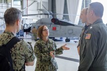 U.S. Navy Adm. Lisa Franchetti, vice chief of Naval Operations, speaks with members of Helicopter Maritime Strike Squadron 37, during a tour of Marine Corps Base Hawaii, Dec. 13, 2022. Franchetti met with base leadership to discuss naval assets, housing, and infrastructure improvements. (U.S. Marine Corps photo by Lance Cpl. Cody Purcell)