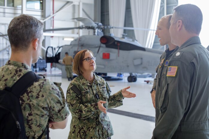 U.S. Navy Adm. Lisa Franchetti, vice chief of Naval Operations, speaks with members of Helicopter Maritime Strike Squadron 37, during a tour of Marine Corps Base Hawaii, Dec. 13, 2022. Franchetti met with base leadership to discuss naval assets, housing, and infrastructure improvements. (U.S. Marine Corps photo by Lance Cpl. Cody Purcell)