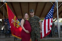 U.S. Marine Corps Cpl. Alec Cruz, a military policeman with the Marine Corps Base Hawaii Provost Marshal’s Office, and his wife Josie Cruz pose for a photo after the United Service Organizations Inc.  Marine of the Year ceremony, MCBH, Dec. 15 2022. The ceremony was held in order to award Cruz the USO Marine of the Year award. (U.S. Marine Corps photo by Lance Cpl. Clayton Baker)