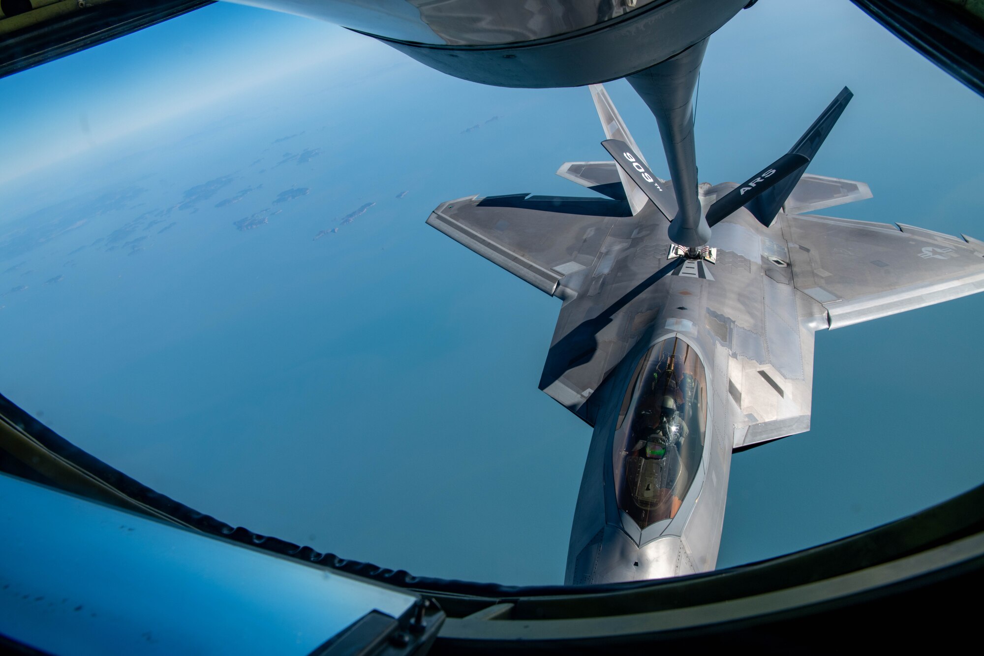 An aircraft receives fuel in air.