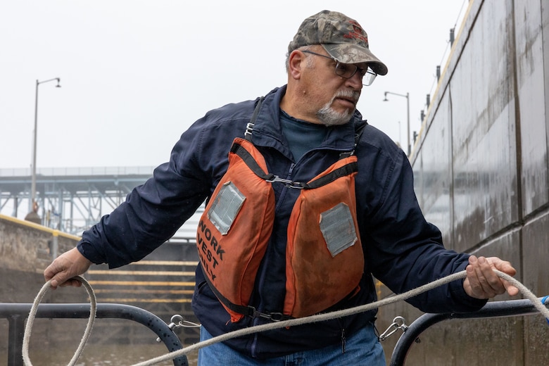 George Brkovich drives a boat and locks through a Lock and Dam.