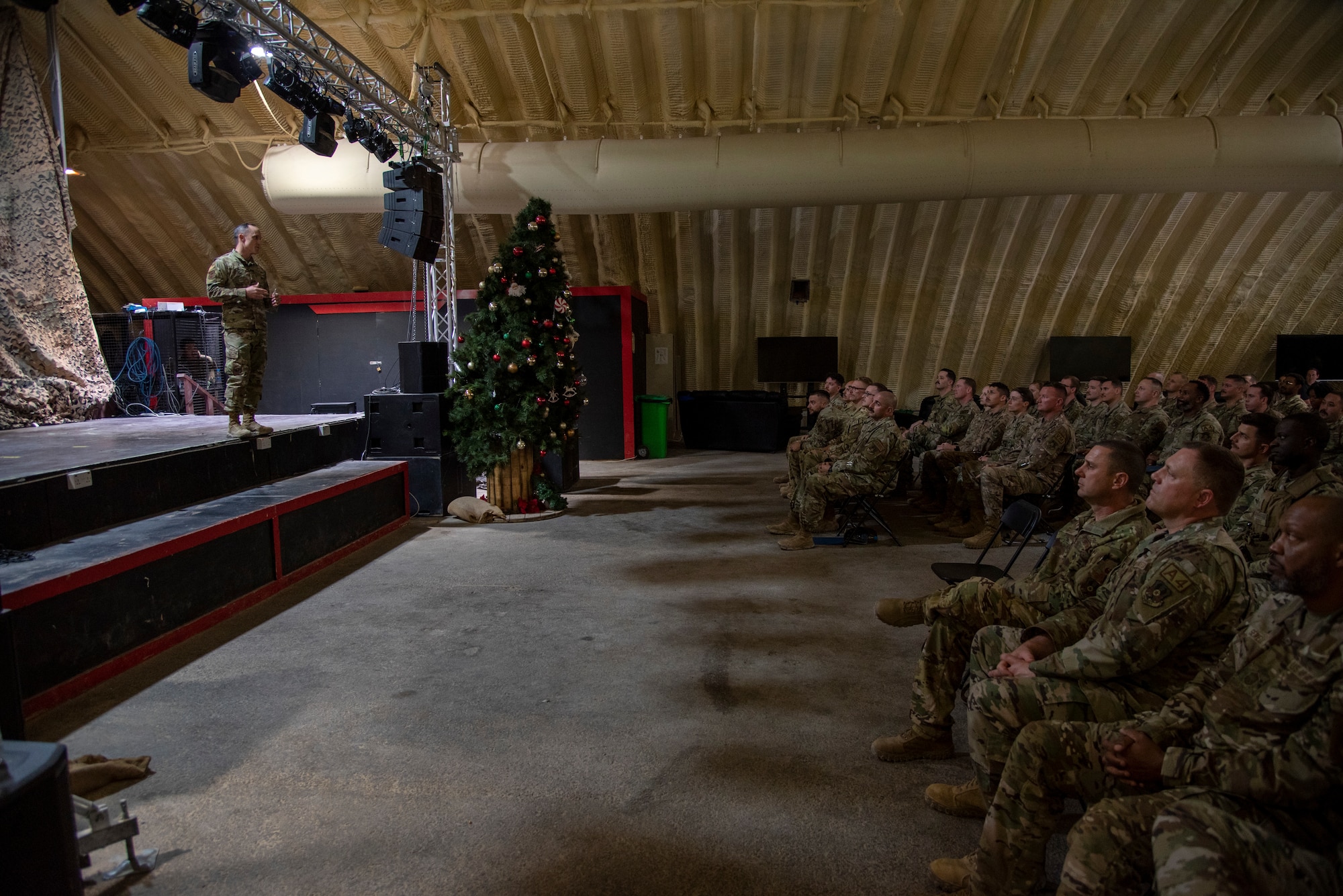 Chief Master Sgt. Kevin Eberlin speaks at the graduation ceremony of First Sergeant Symposium at the 332d Air Expeditionary Wing at an undisclosed location, Southwest Asia, Dec 20, 2022. This class prepared airmen for some of the challenges they may face if assigned to the position. (U.S. Air Force photo by: Tech. Sgt. Jim Bentley)