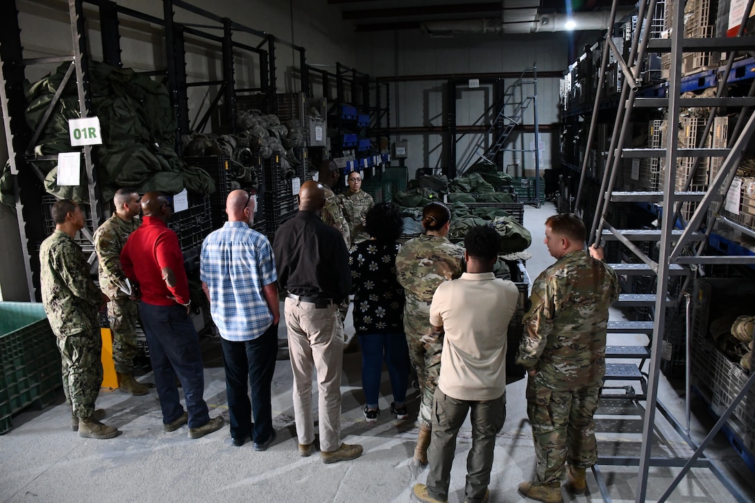 A group of people get a warehouse tour