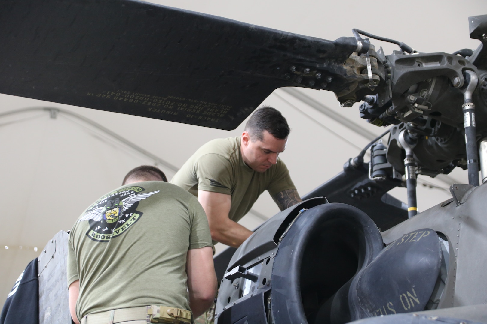 U.S. Army Spc. Justin Lee, aviation maintenance technician for Delta Company, 2nd Battalion, 149th Aviation Regiment, General Support Aviation Battalion, 36th Combat Aviation Brigade, conducts maintenance on U.S. Army rotary aircraft at Al Asad Air Base, Iraq, Dec. 10, 2022.