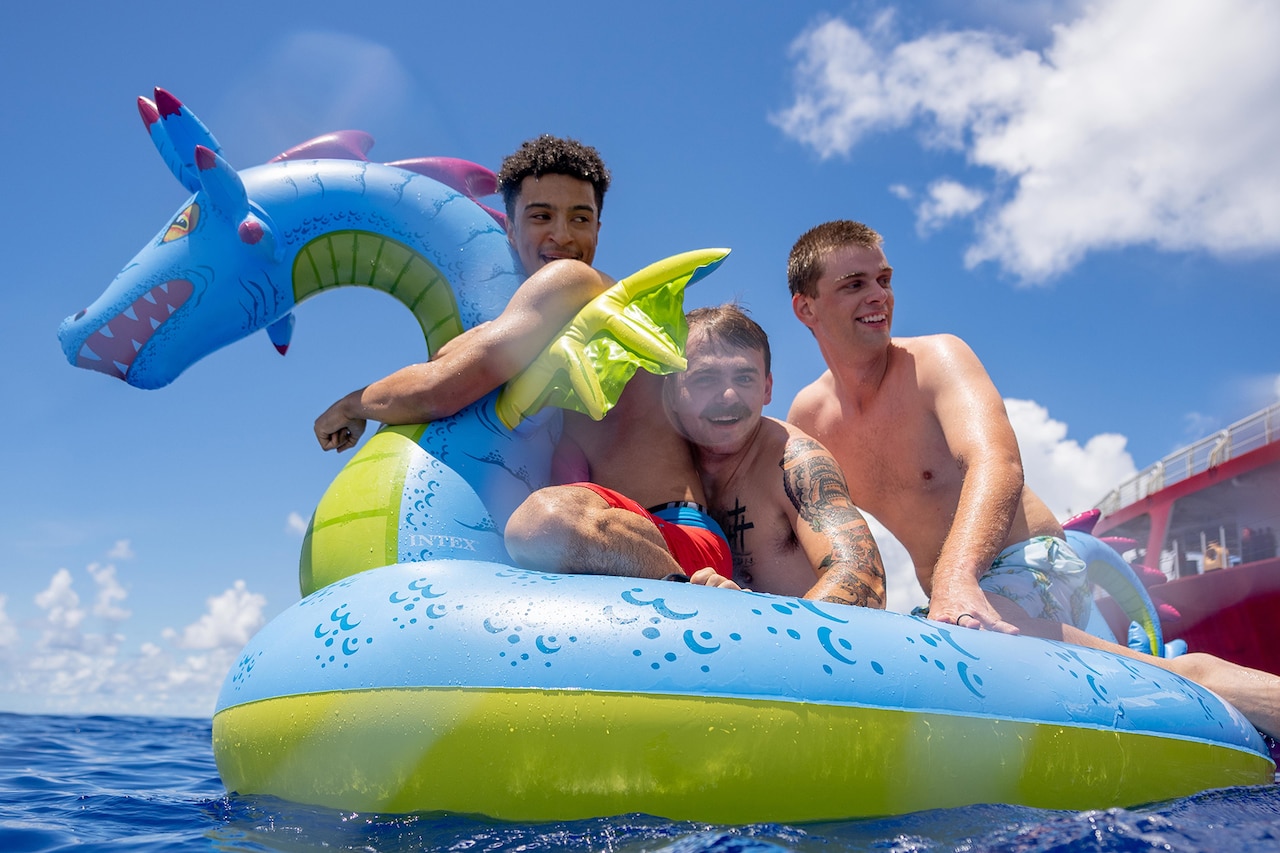 Coast Guardsmen enjoy a swim in the Pacific Ocean.