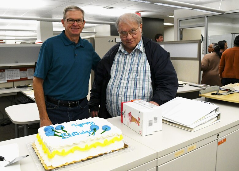 John Tribble, retired Technical Support Branch chief, joined Supervisory Electrical Engineer David Mistakovich in a birthday cake-cutting celebration during the round-robin Christmas party at the Nashville District office on December 8, 2022.