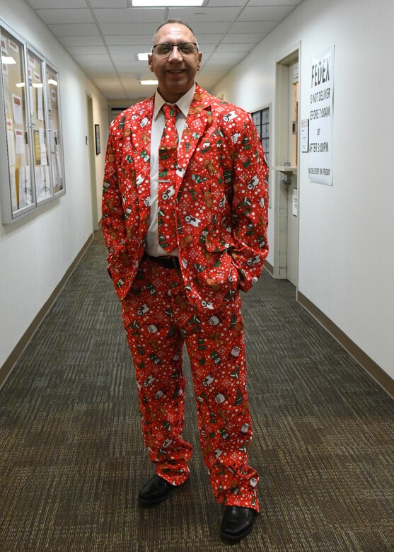 Equal Employment Opportunity Specialist David Claussen spreads holiday cheer in his festive Christmas suit to the Nashville District round-robin Christmas party at the Nashville District office on December 8, 2022.