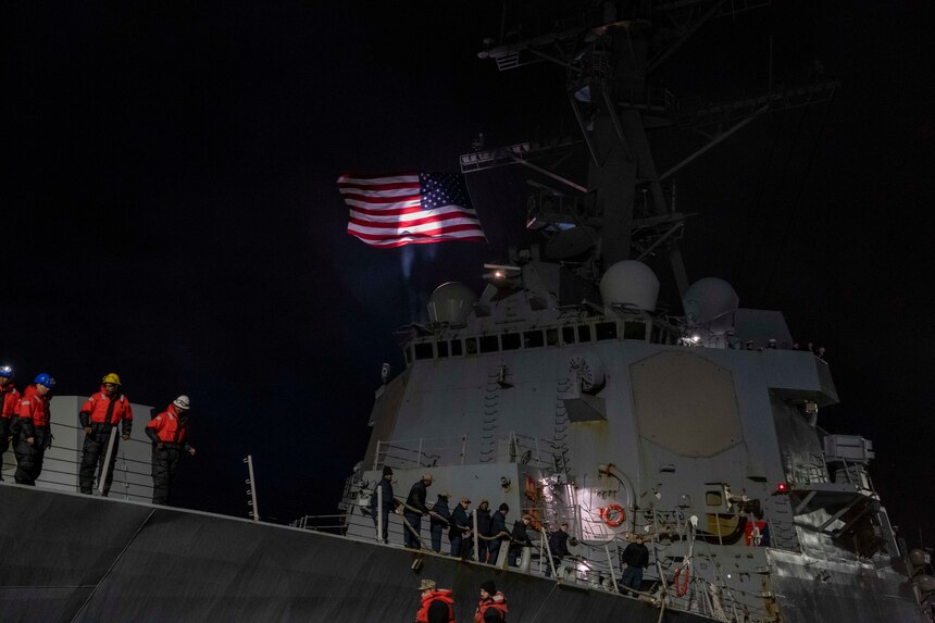 Sailors assigned to the Arleigh Burke-class guided-missile destroyer USS Forrest Sherman (DDG 98) heave in mooring lines as the ship returns to Naval Station Norfolk, Dec 22. Forrest Sherman returned to Naval Station Norfolk following a scheduled deployment with Allies and partners as the flagship for Standing NATO Maritime Group Two (SNMG 2) conducting presence operations and exercises in the European Theater.