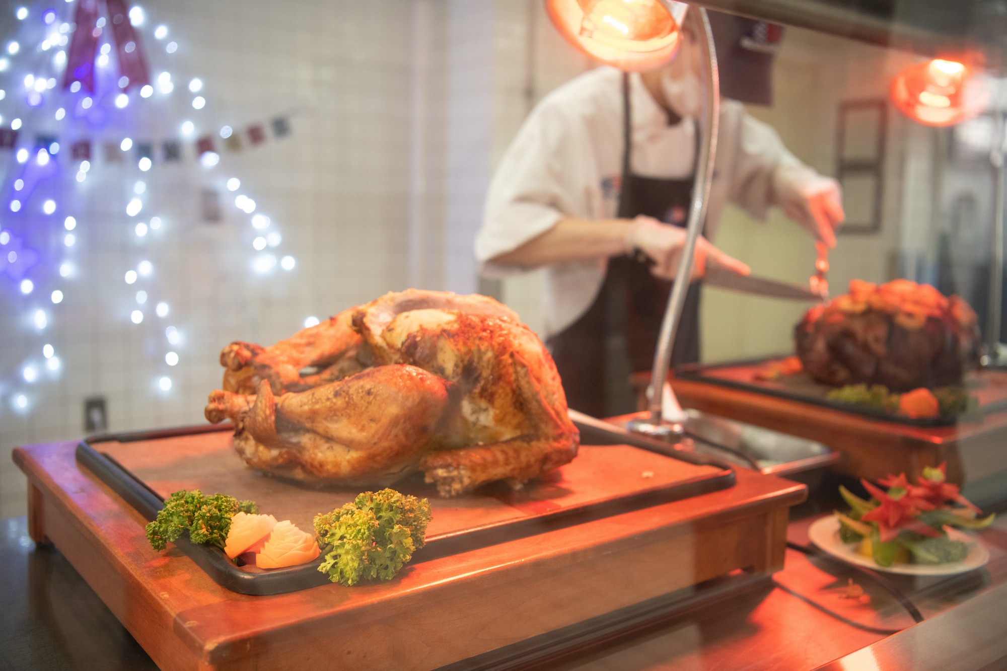 A roasted chicken sits ready to be served