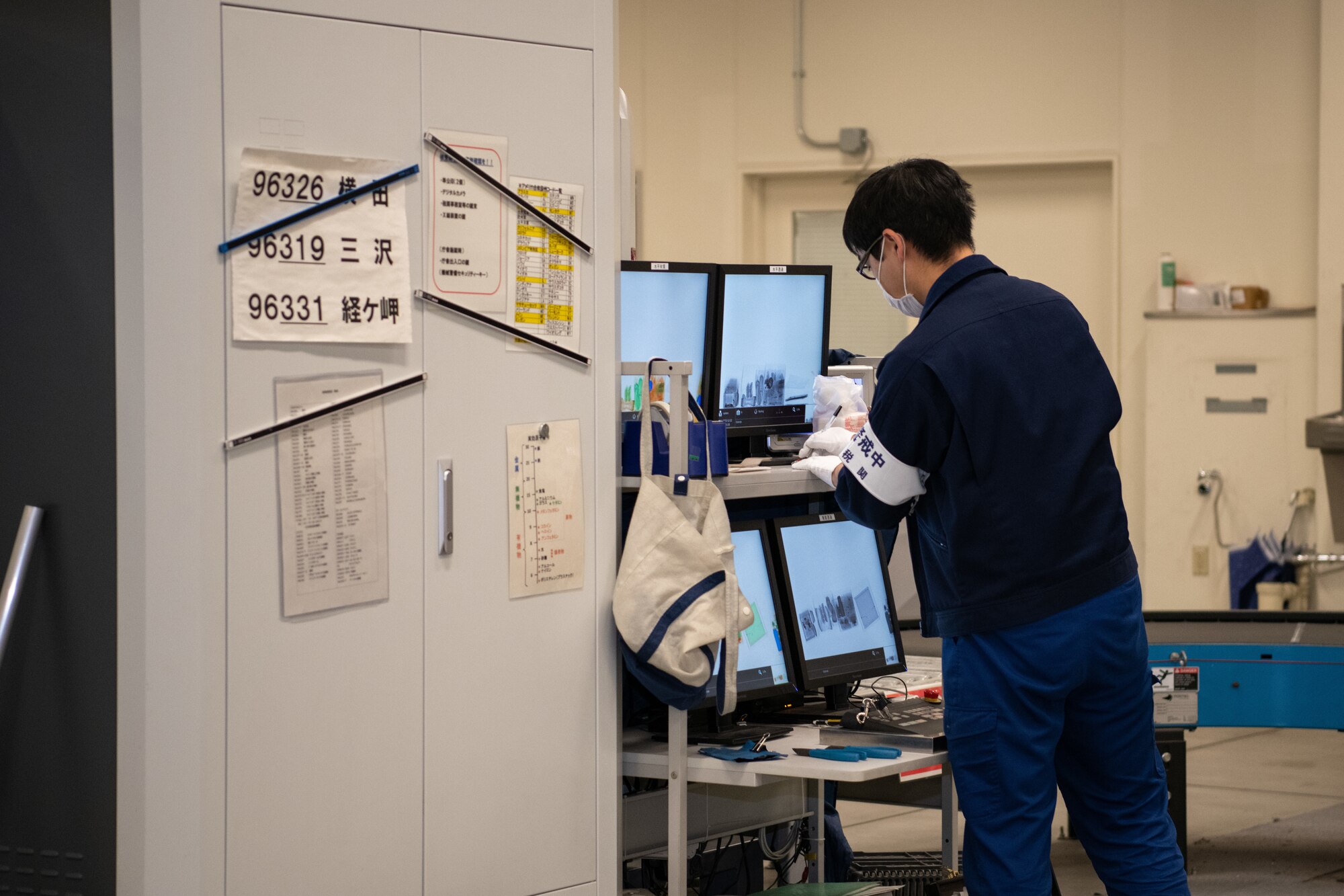 Customs personnel x-ray packages