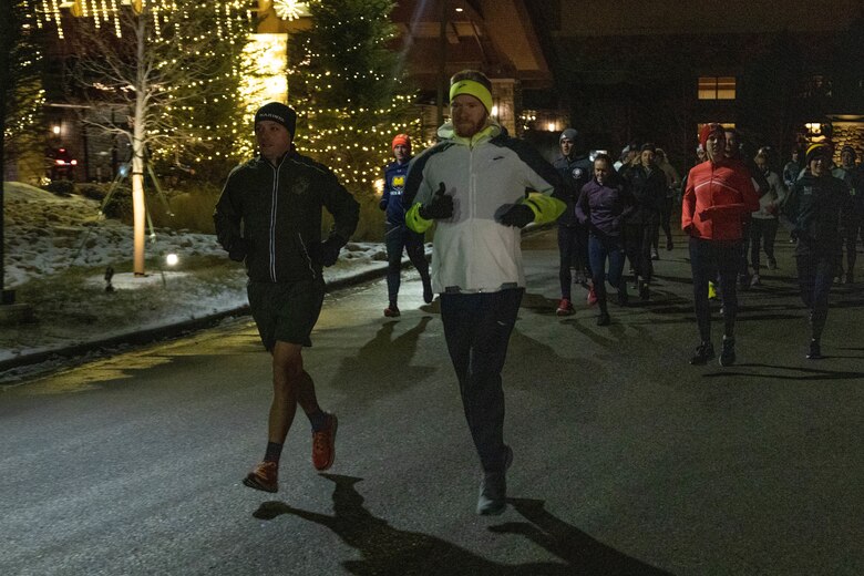 U.S. Marine Corps Michael Wood, an occupational field manager with the Judge Advocate Division, Headquarters, Marine Corps, leads a 2-mile morning run with the coaches during the United States Track & Field and Cross-Country Coaches Association Convention in Aurora, Colo., Dec. 14, 2022. The Marine Corps Recruiting Command is proud to partner with USTFCCCA, during the convention Marines were able to network, participate in professional development sessions with coaches and celebrate the National High School Coaches of the year. (U.S. Marine Corps photo by Lance Cpl. Jennifer Sanchez)