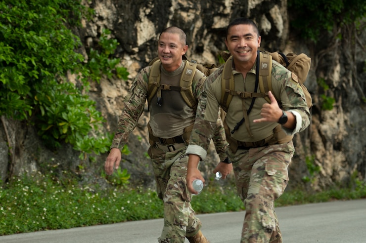 U.S. Air Force service members walk up Sanders Slope during the Office of Special Investigations’ Hustler-6 memorial event on Andersen Air Force Base, Guam, Dec. 21, 2022. Since 2016, OSI agents assigned to Andersen AFB have annually honored the Hustler-6, who lost their lives during a mission near Bagram, Afghanistan on Dec. 21, 2015, by rucking up and down Sanders Slope.