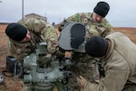 Soldiers with the Nebraska Army National Guard 1-134th Cavalry Squadron and 2-134th Infantry Battalion set up tripods before a TOW Missile System training exercise at Fort Riley, Kansas, Dec. 13, 2022. The unit was given 32 missiles and each Soldier was able to shoot at least twice.