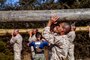 U.S. Marine Corps Rct. Louis Youngblood, a recruit with India Company, 3rd Recruit Training Battalion, conducts log exercises during log drills at Marine Corps Recruit Depot San Diego, Dec. 19, 2022.