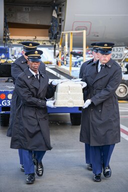 The Utah National Guard Honor Guard conducts an Honorable Carry on Dec. 15, 2022, for the surviving family of U.S. Army Air Forces Cpl. Merle L. Pickup, a Soldier who died in India, 78 years ago, following a plane crash during World War II. Reported MIA in 1944, Pickup’s remains were recently identified and now repatriated to his home in Utah nearly 80 years later. Family coming from several states, even as far as Europe, gathered to render respect during the carry at Salt Lake City International Airport. (U.S. Army National Guard photo by Staff Sgt. Jordan Hack)