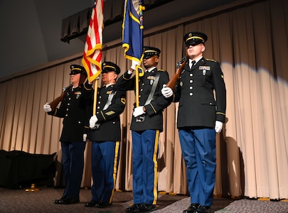 The Utah National Guard Honor Guard presents the colors at the change-of-responsibility ceremony. The Utah Army National Guard welcomes its new command chief warrant officer during a change-of-responsibility ceremony, Dec. 5, 2022, in the Draper headquarters’ auditorium. During the ceremony, Command Chief Warrant Officer 5 Brian Searcy relinquishes the role of command chief of the Utah Army National Guard to Command Chief Warrant Officer 5 William Erickson. (U.S. Army National Guard photo by Staff Sgt. Cambrin Bassett)