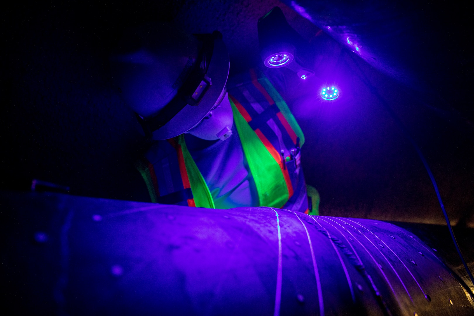 A contracted mechanical and integrity engineer working for Naval Facilities Engineering Systems Command Fleet Logistics Center Pearl Harbor, conducts a three-dimensional scan on to confirm structural integrity of fuel pipes at the Red Hill Bulk Fuel Storage Facility (RHBFSF) in Halawa, Hawaii, Dec. 20, 2022. Joint Task Force-Red Hill was established by the Department of Defense to ensure the safe and expeditious defueling of the RHBFSF. (U.S. Army photo by Spc. Matthew Mackintosh)