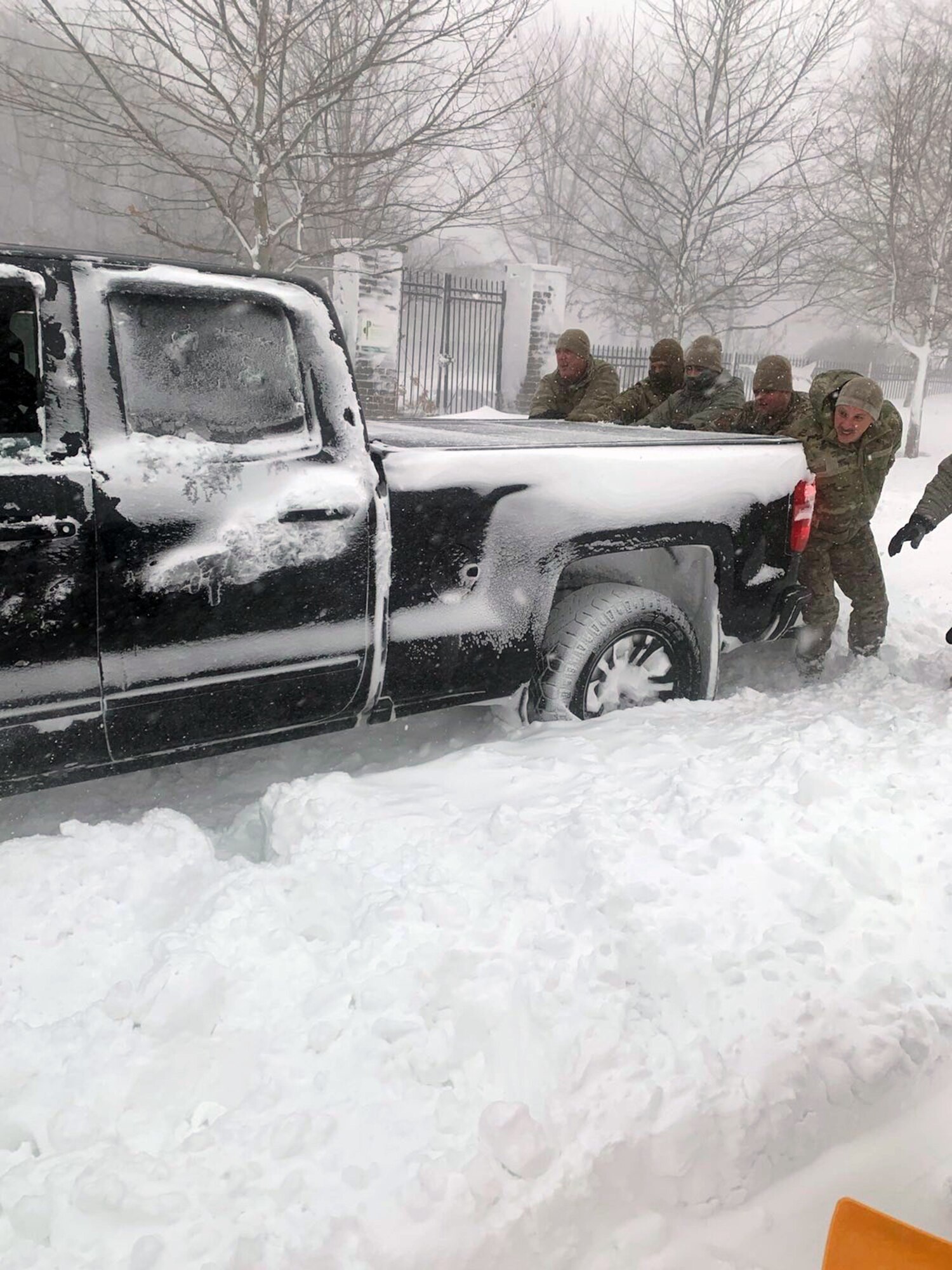 New York Air National Guard Airmen assigned to the 107th Attack Wing at Niagara Falls Air Reserve Station assist motorists stuck in snow drifts near Buffalo, New York, Dec. 25, 2022, during whiteout blizzard conditions.