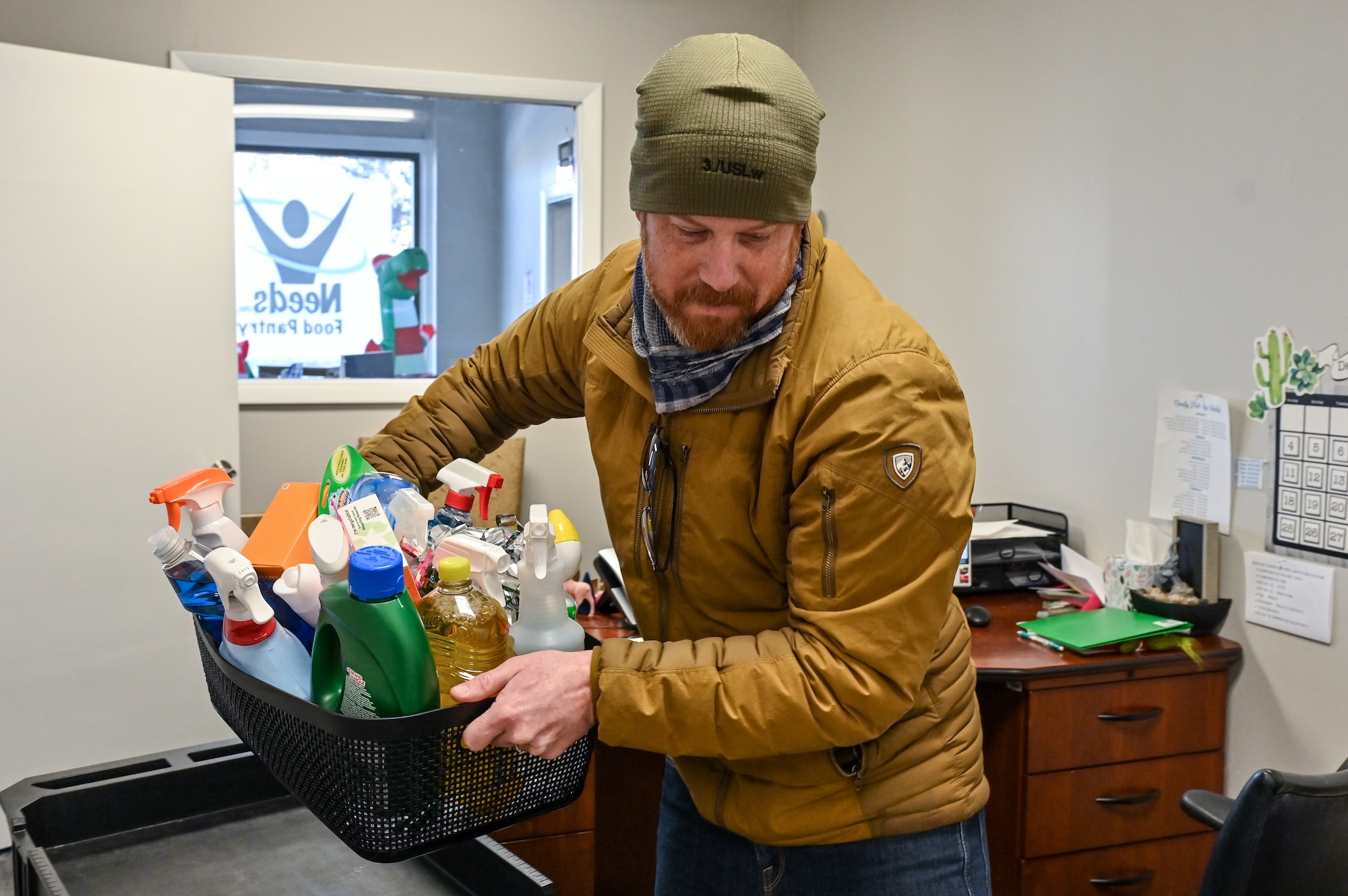 David Cook, 90th Contracting Squadron contracting specialist, drops off presents for local families in need as part of Needs Inc Adopt a Family Program in Cheyenne, Wyoming, Dec 19, 2022. 90 CONS came together for the second year in a row to support two families in need, so they did not have to choose between giving their kids food or celebrating the holiday season. (U.S. Air Force photo by Joseph Coslett Jr.)